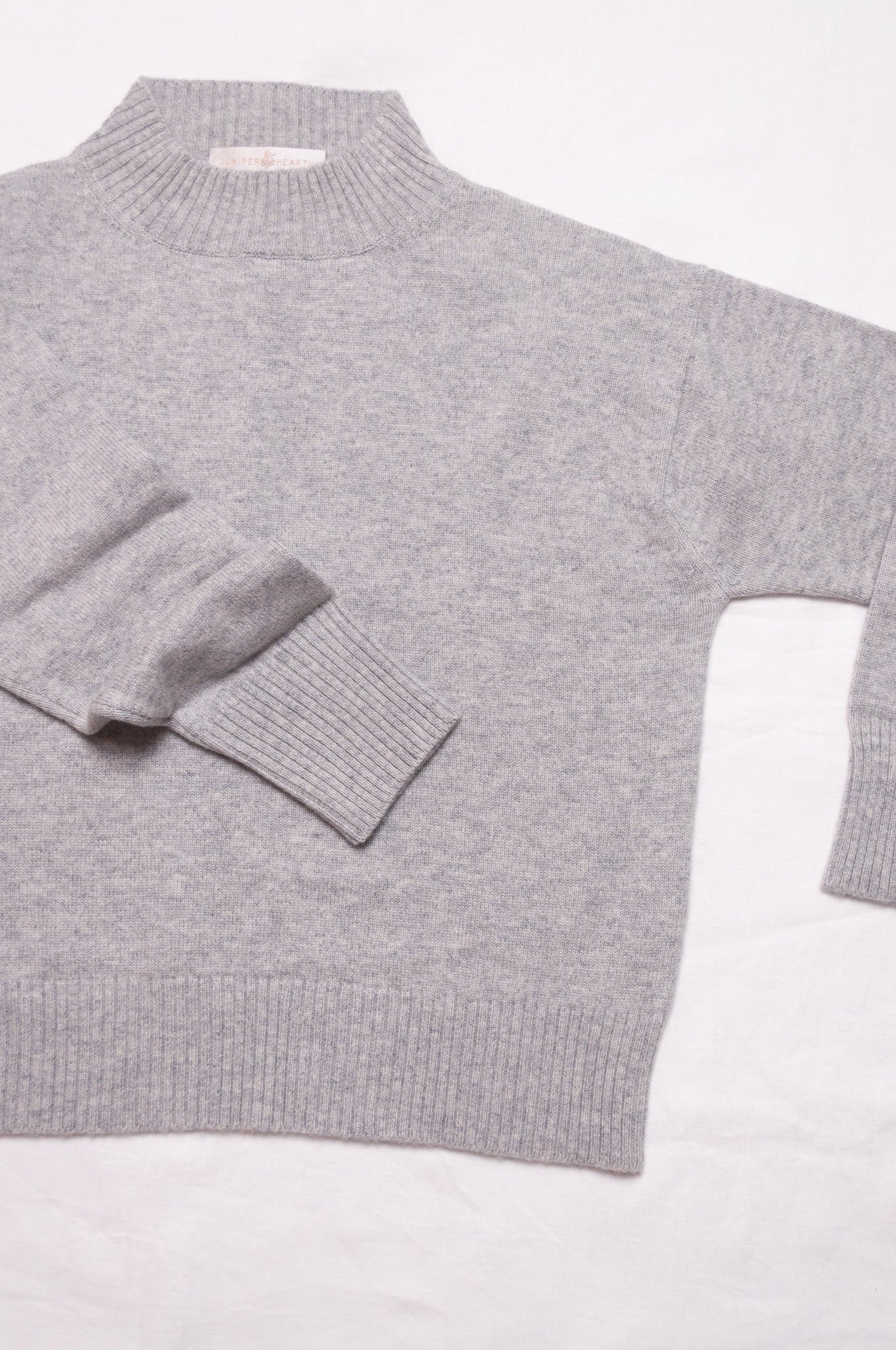 Juniper Hearth high neck turtleneck cashmere sweater in ash grey.