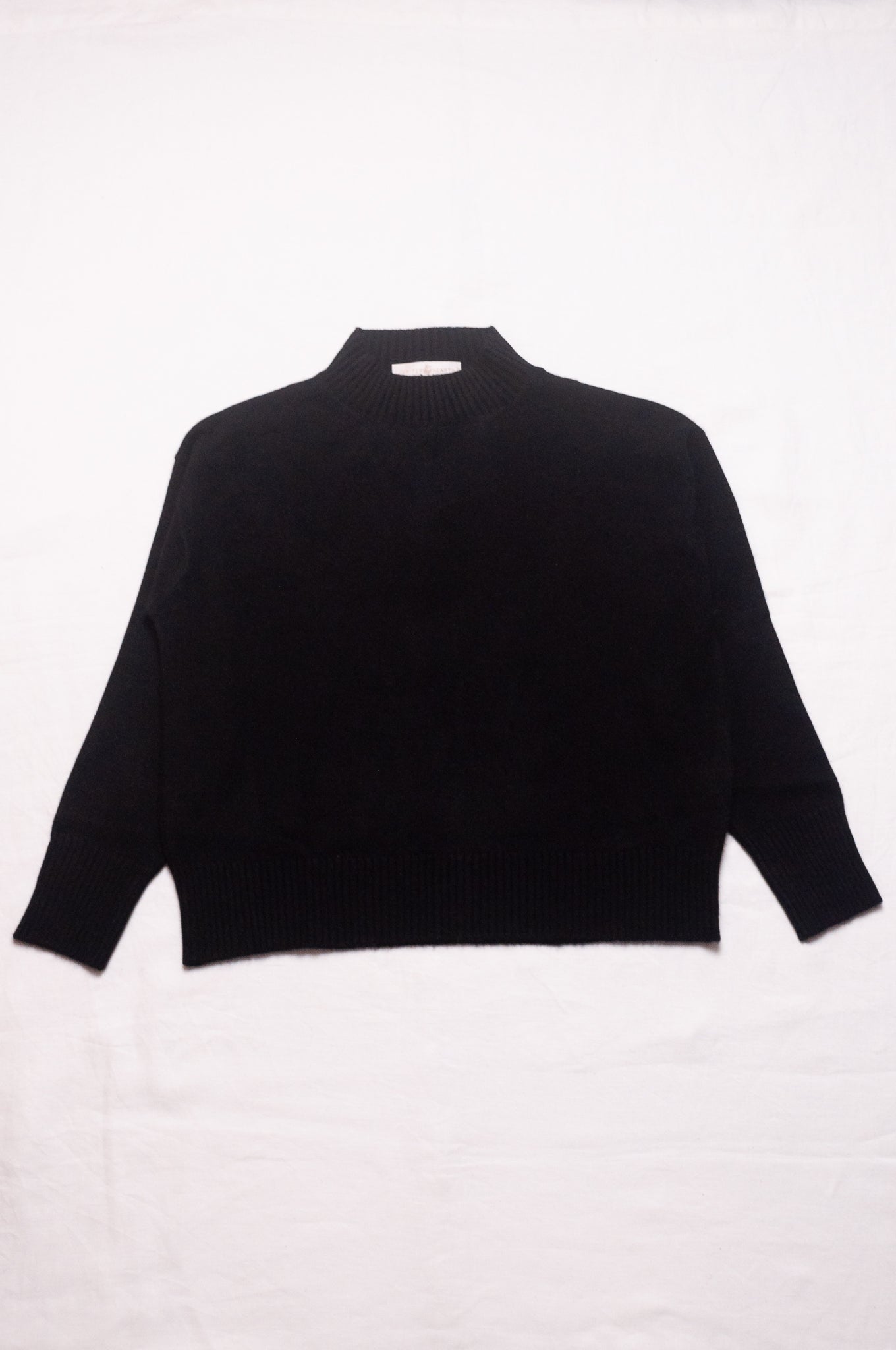 Juniper Hearth high neck turtleneck cashmere sweater in black.