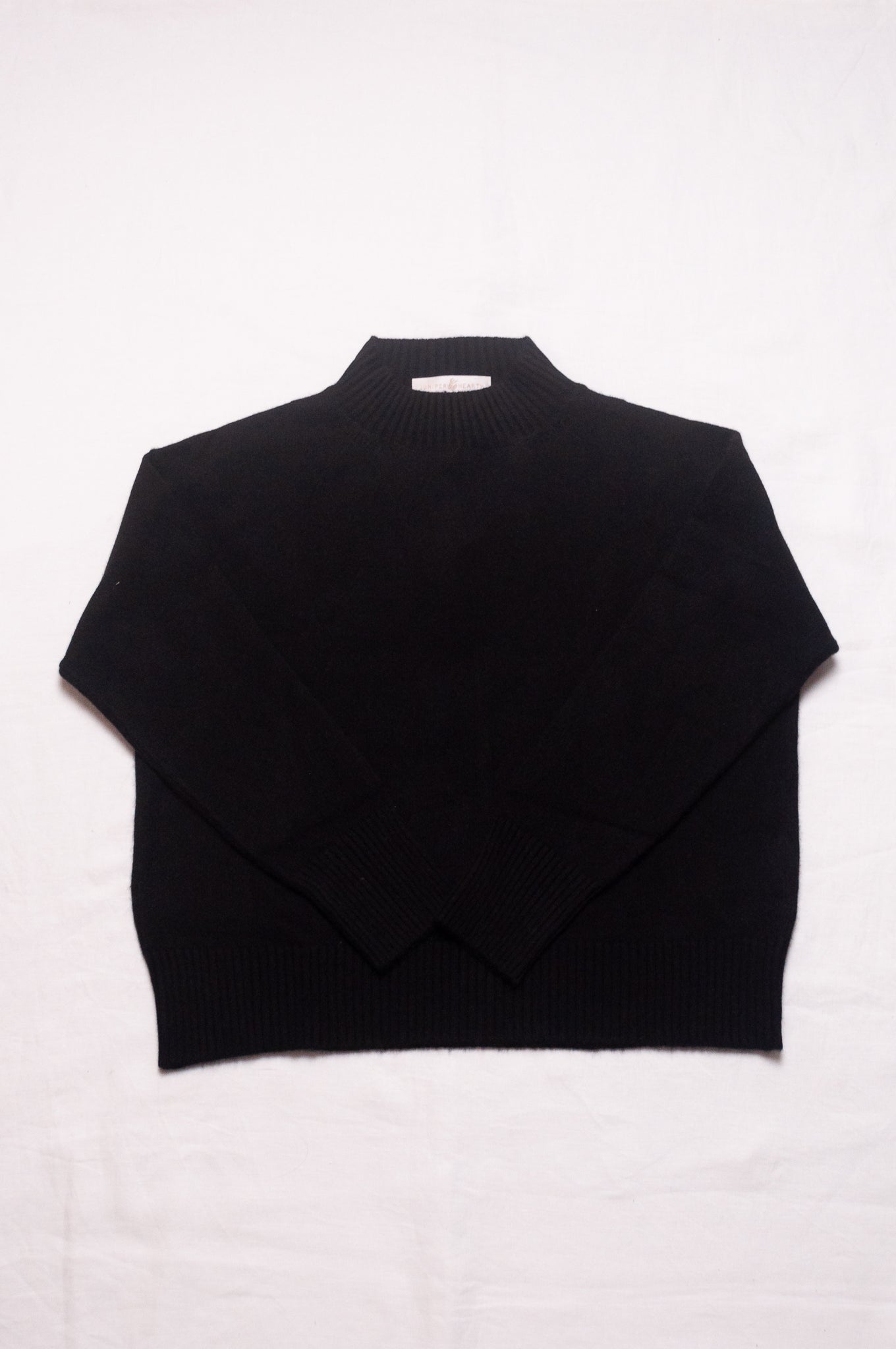 Juniper Hearth high neck turtleneck cashmere sweater in black.