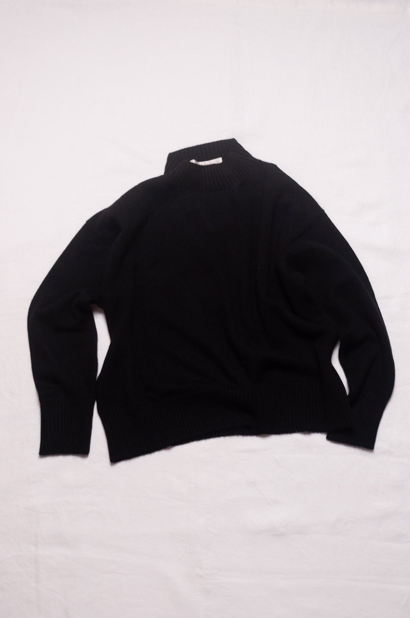 Juniper Hearth high neck turtleneck cashmere sweater in black.