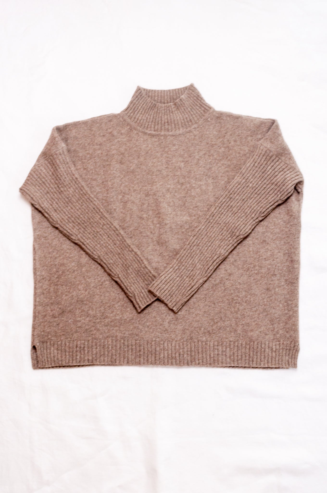 Maxim one size turtle neck rib sleeve sweater in natural baby yak wool.