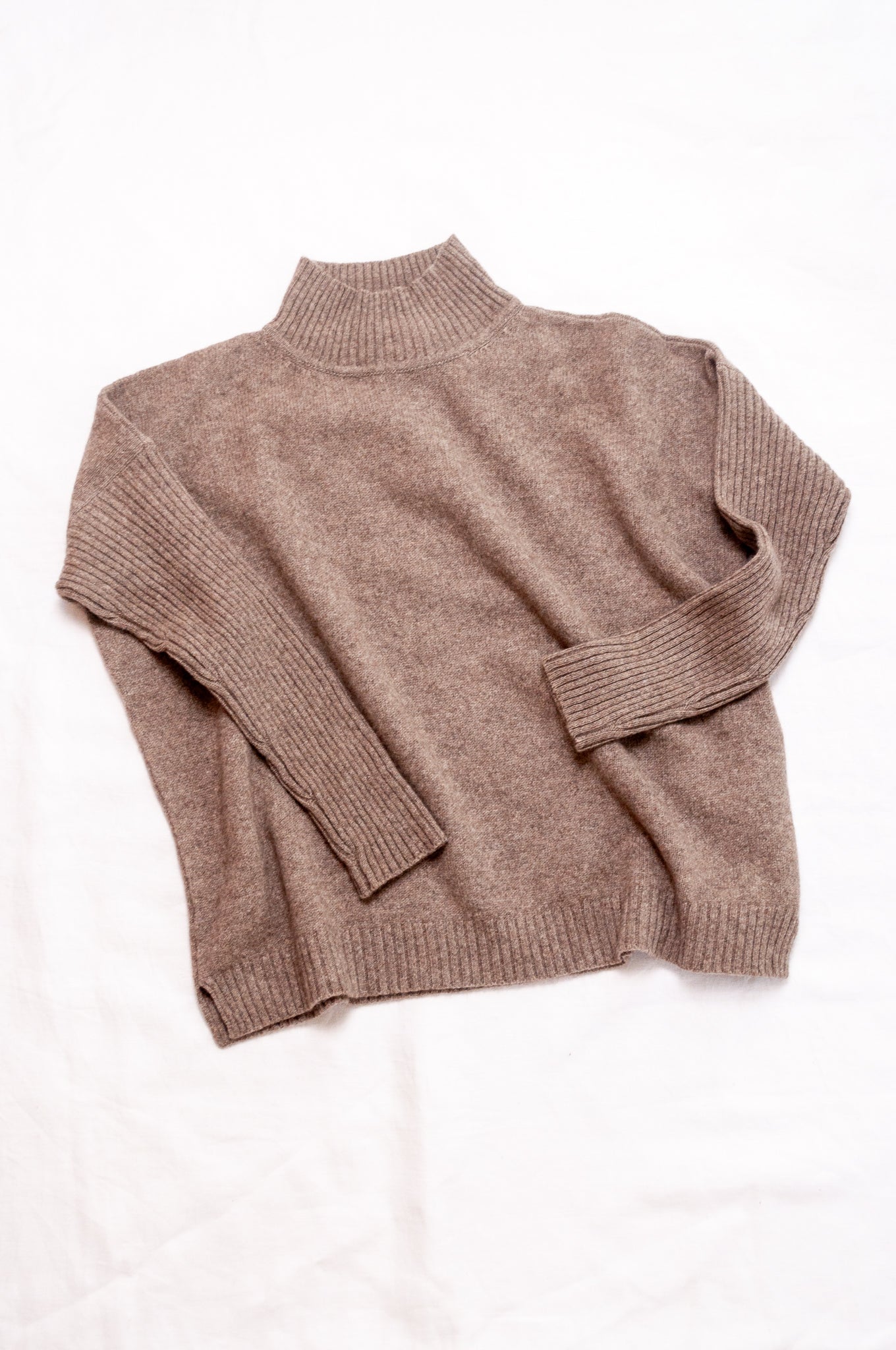 Maxim one size turtle neck rib sleeve sweater in natural baby yak wool.