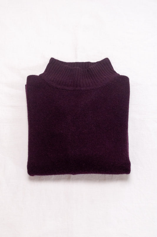 Baby yak wool Maxim one size turtle neck sweater with rib sleeves in aubergine.