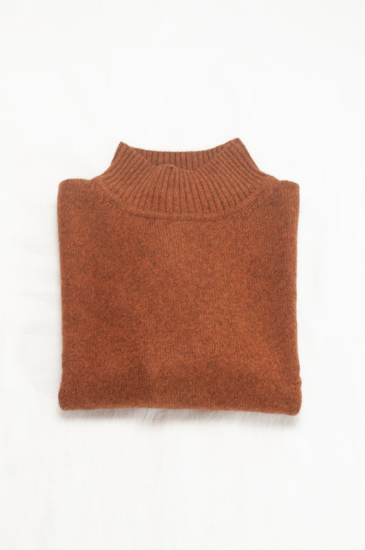 Baby yak wool Maxim one size turtle neck sweater with rib sleeves in rust brown.
