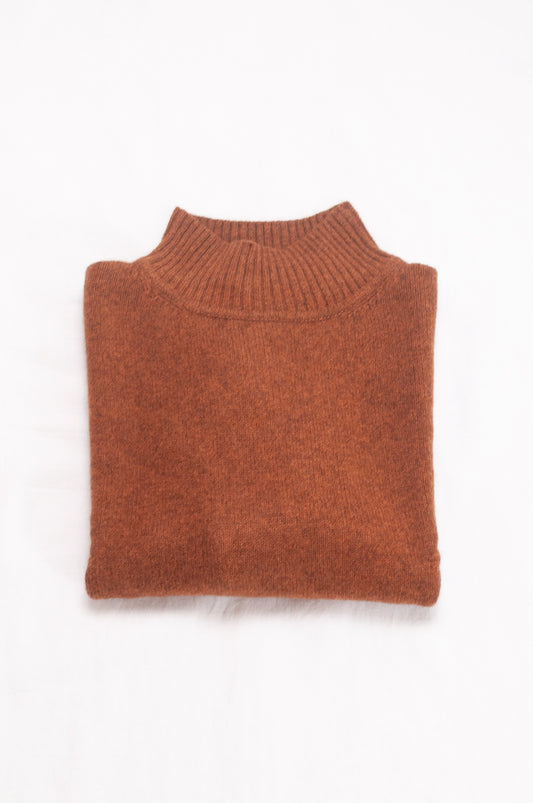 Baby yak wool Maxim one size turtle neck sweater with rib sleeves in rust brown.