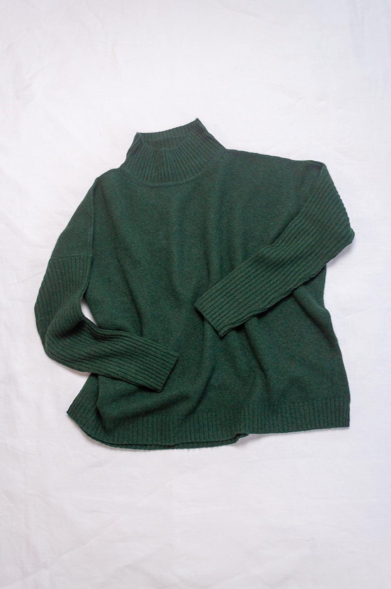 Baby yak wool Maxim one size turtle neck sweater with rib sleeves in dark hunter green forest green.