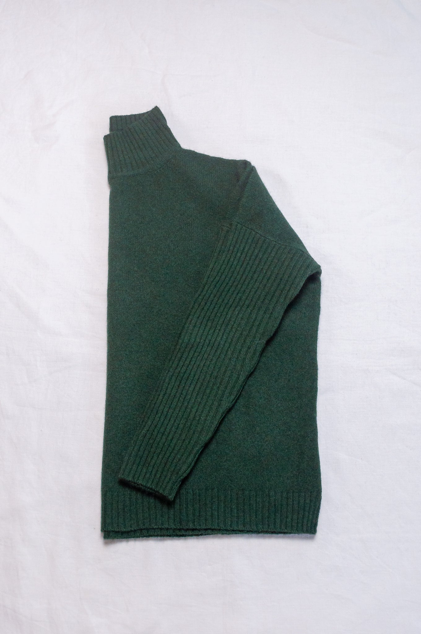 Baby yak wool Maxim one size turtle neck sweater with rib sleeves in dark hunter green forest green.