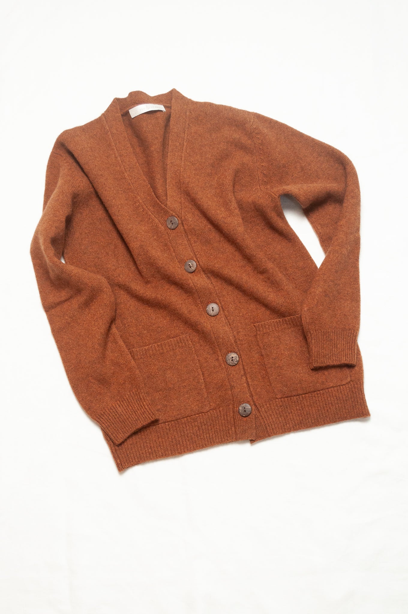 Baby yak wool Ines V-neck button up cardigan in rust brown.