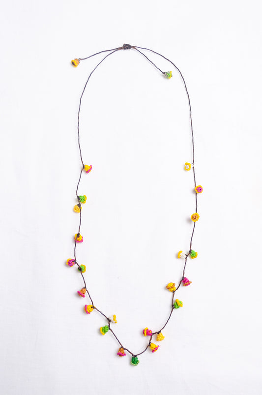 Handmade Moroccan button necklace in bright lemon yellow, rose pink and leaf green.