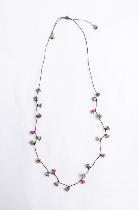 Handmade Moroccan button necklace in  rose pink and sage greens.