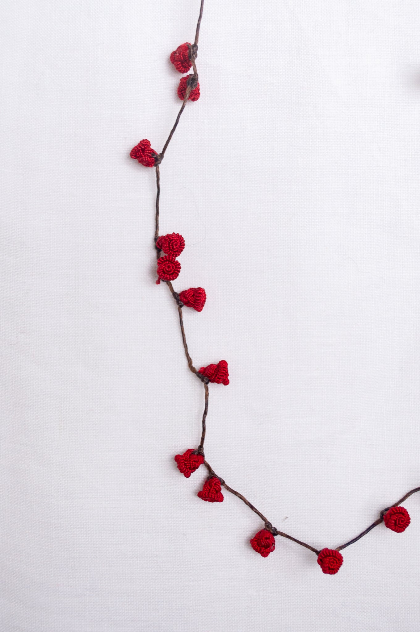 Handmade Moroccan button necklace in  rose red.