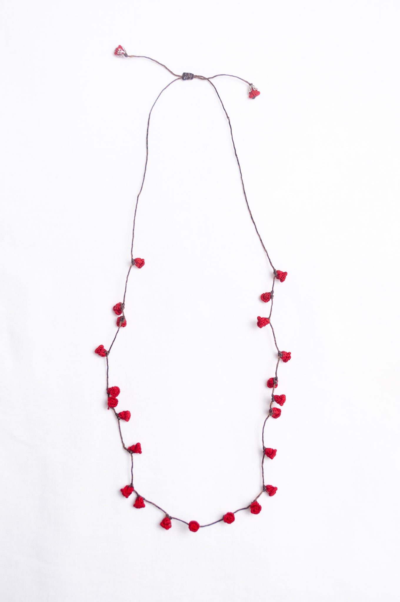 Handmade Moroccan button necklace in  rose red.