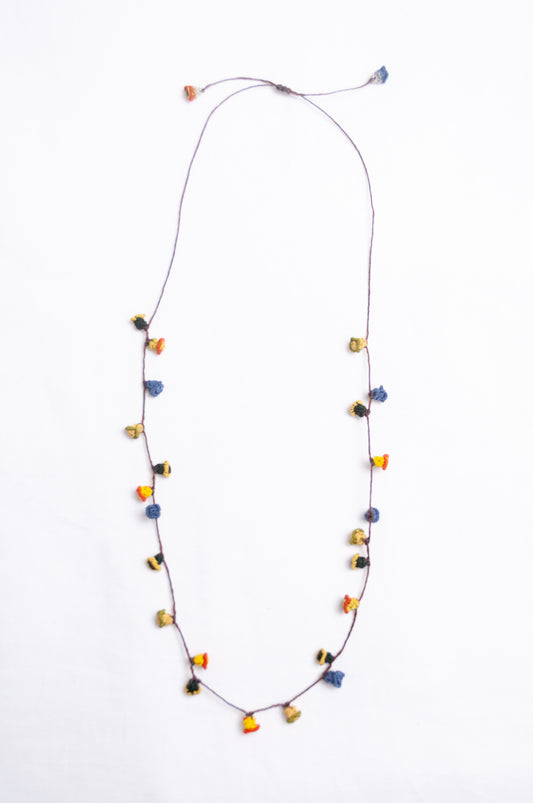 Handmade Moroccan button necklace in  blue, olive, mustard and pink.