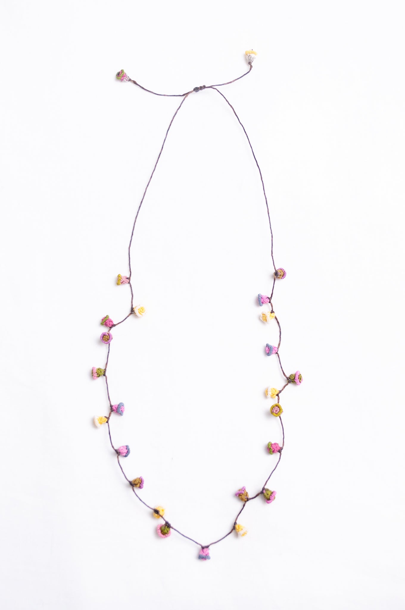 Handmade Moroccan button necklace in  soft pink, lemon and olive.