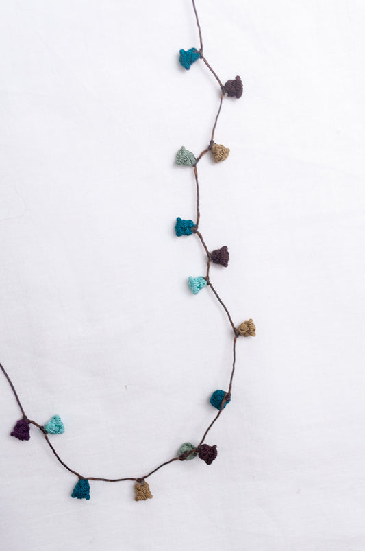 Handmade Moroccan button necklace in  shades of green and brown.