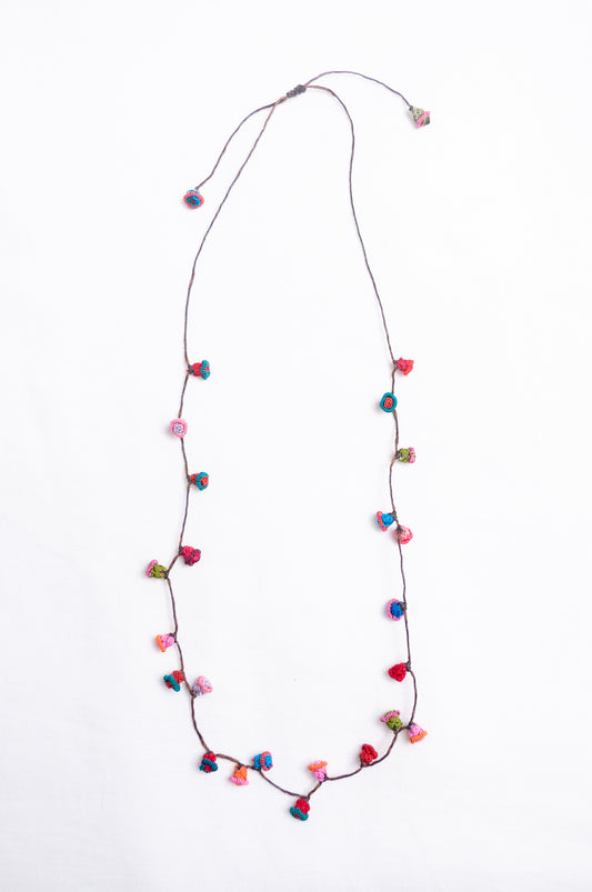 Handmade Moroccan button necklace in  turquoise, pink and red.