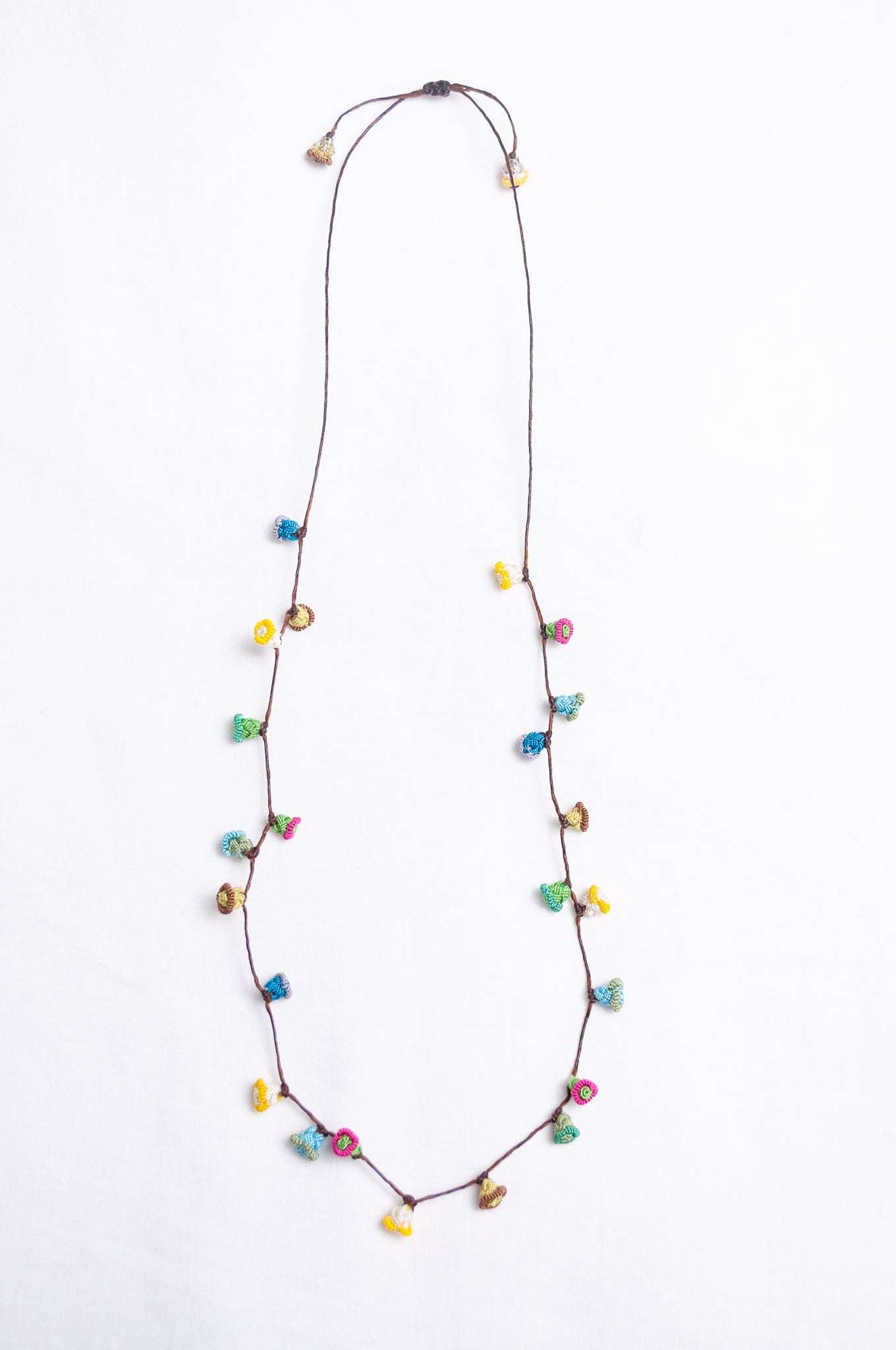 Handmade Moroccan button necklace in  soft pastels.