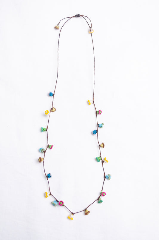 Handmade Moroccan button necklace in  soft pastels.