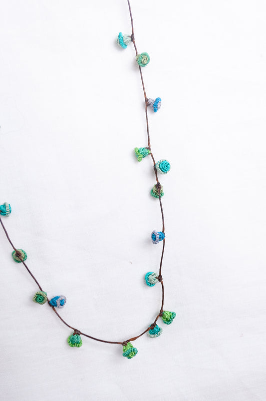 Handmade Moroccan button necklace in  blues and greens.