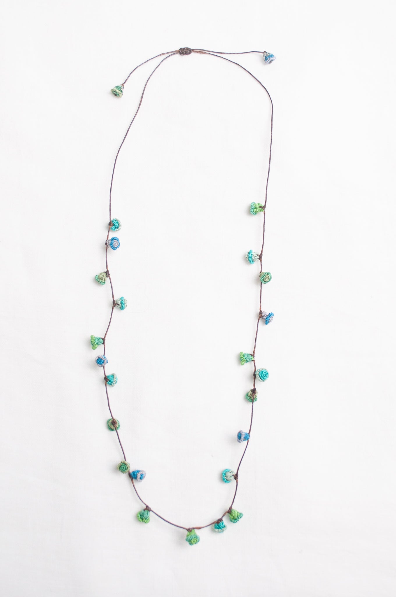 Handmade Moroccan button necklace in  blues and greens.