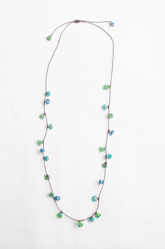Handmade Moroccan button necklace in  blues and greens.