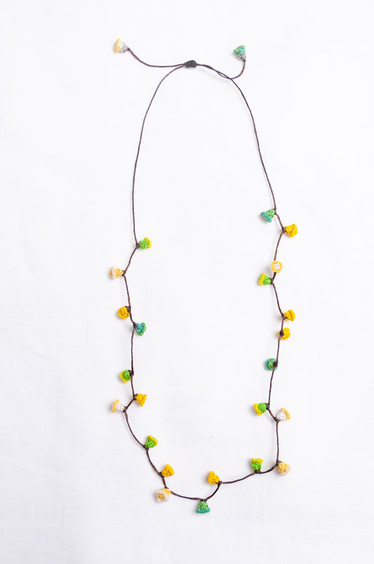 Handmade Moroccan button necklace in  lemon yellow and lime green.