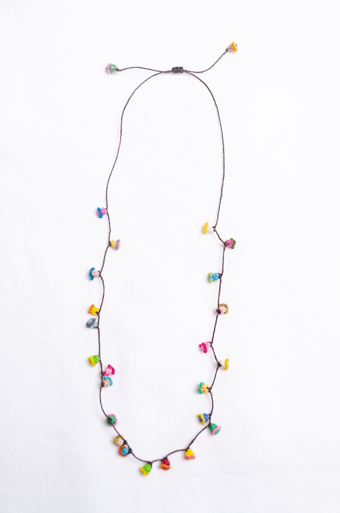 Handmade Moroccan button necklace in  bright pastels.