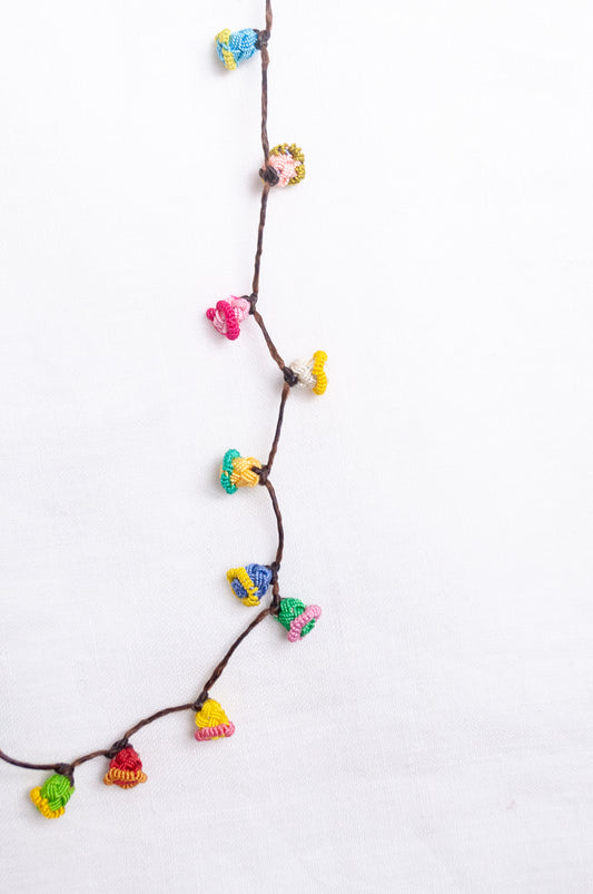 Handmade Moroccan button necklace in  bright pastels.