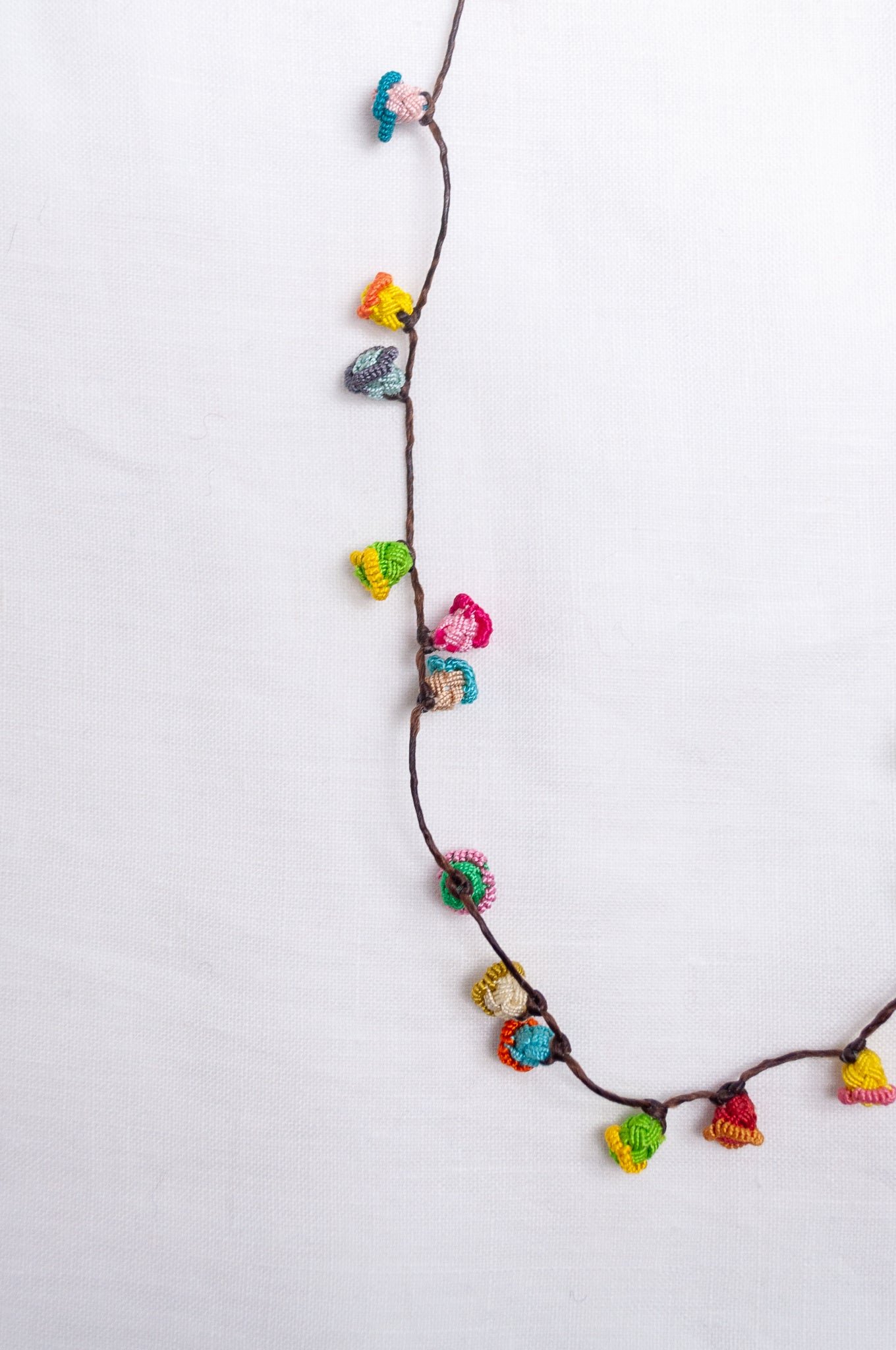 Handmade Moroccan button necklace in  bright pastels.