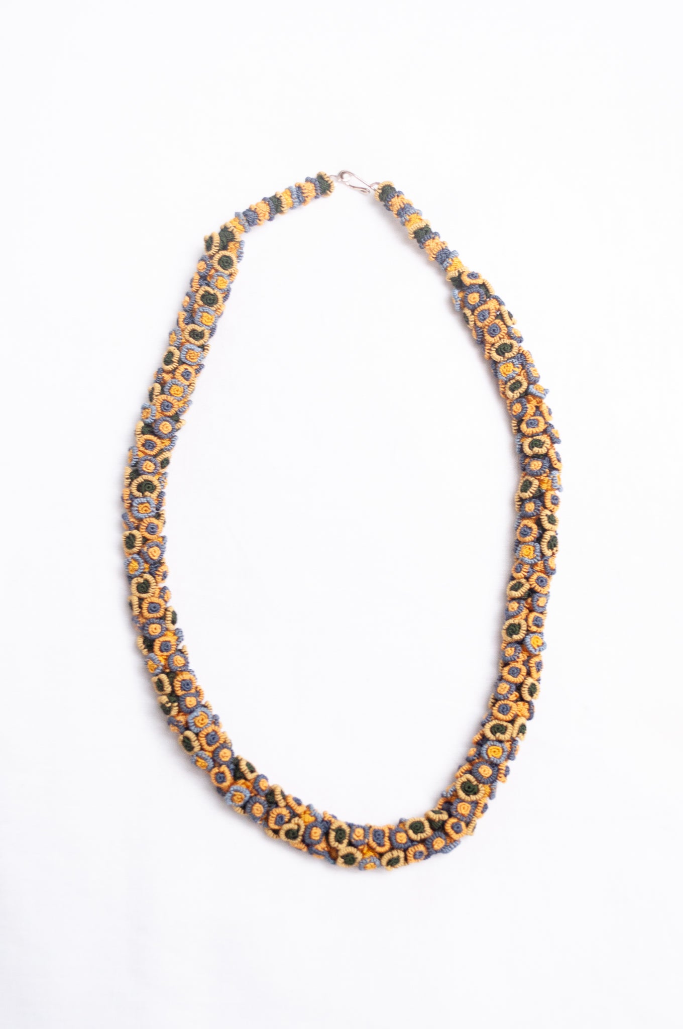 Moroccan flower button Oznati necklace in mustard yellow, latte and grey.