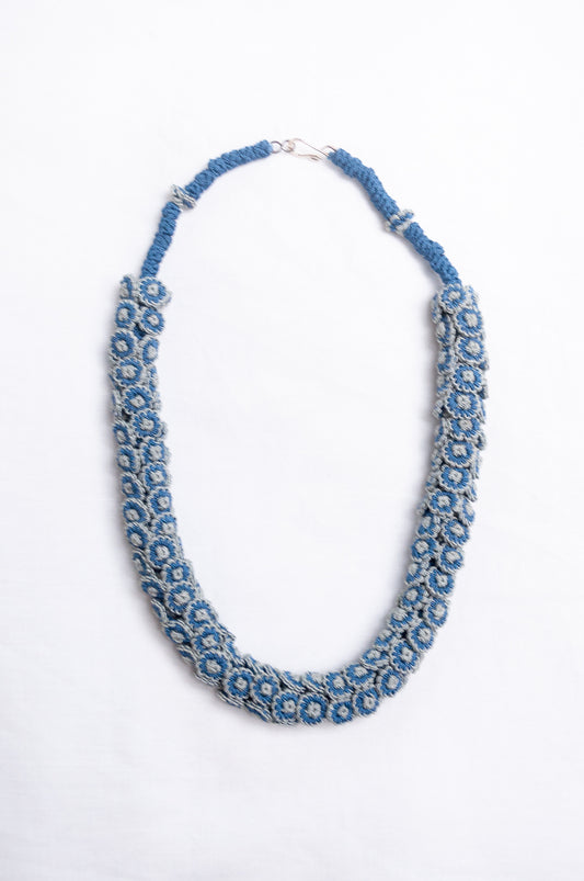 Moroccan button Latifa necklace in denim blue and silver grey button flowers.