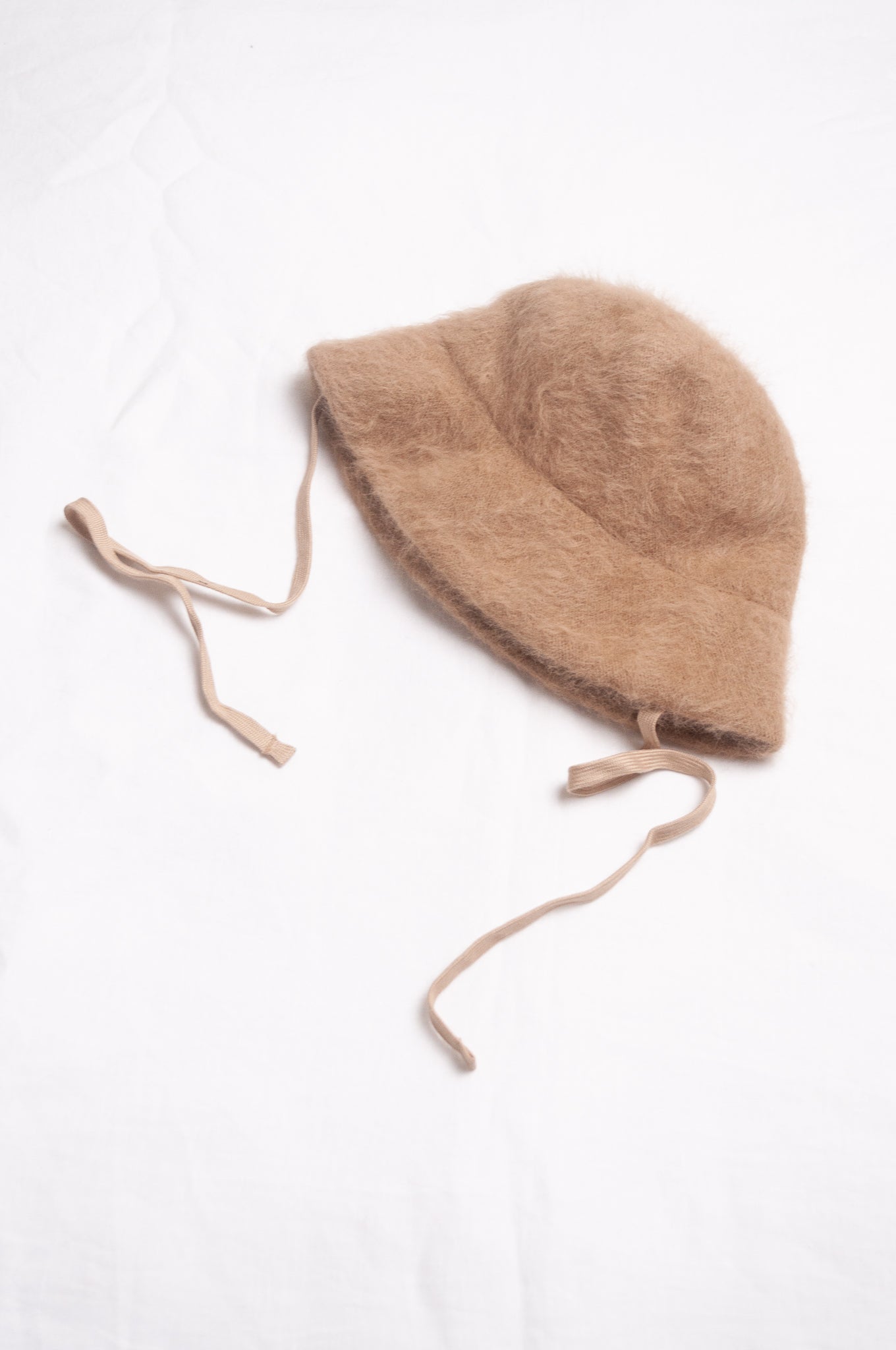 Parcnique PCNQ Bell cloche hat in angora wool blend with ribbon ties in camel beige.