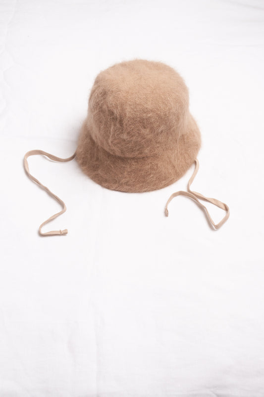 Parcnique PCNQ Bell cloche hat in angora wool blend with ribbon ties in camel beige.