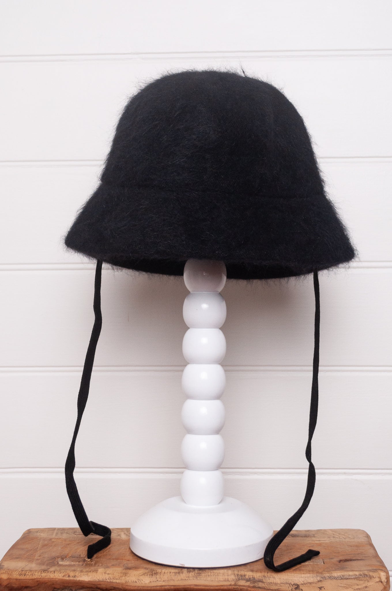 Parcnique PCNQ Bell cloche hat in angora wool blend with ribbon ties in black.