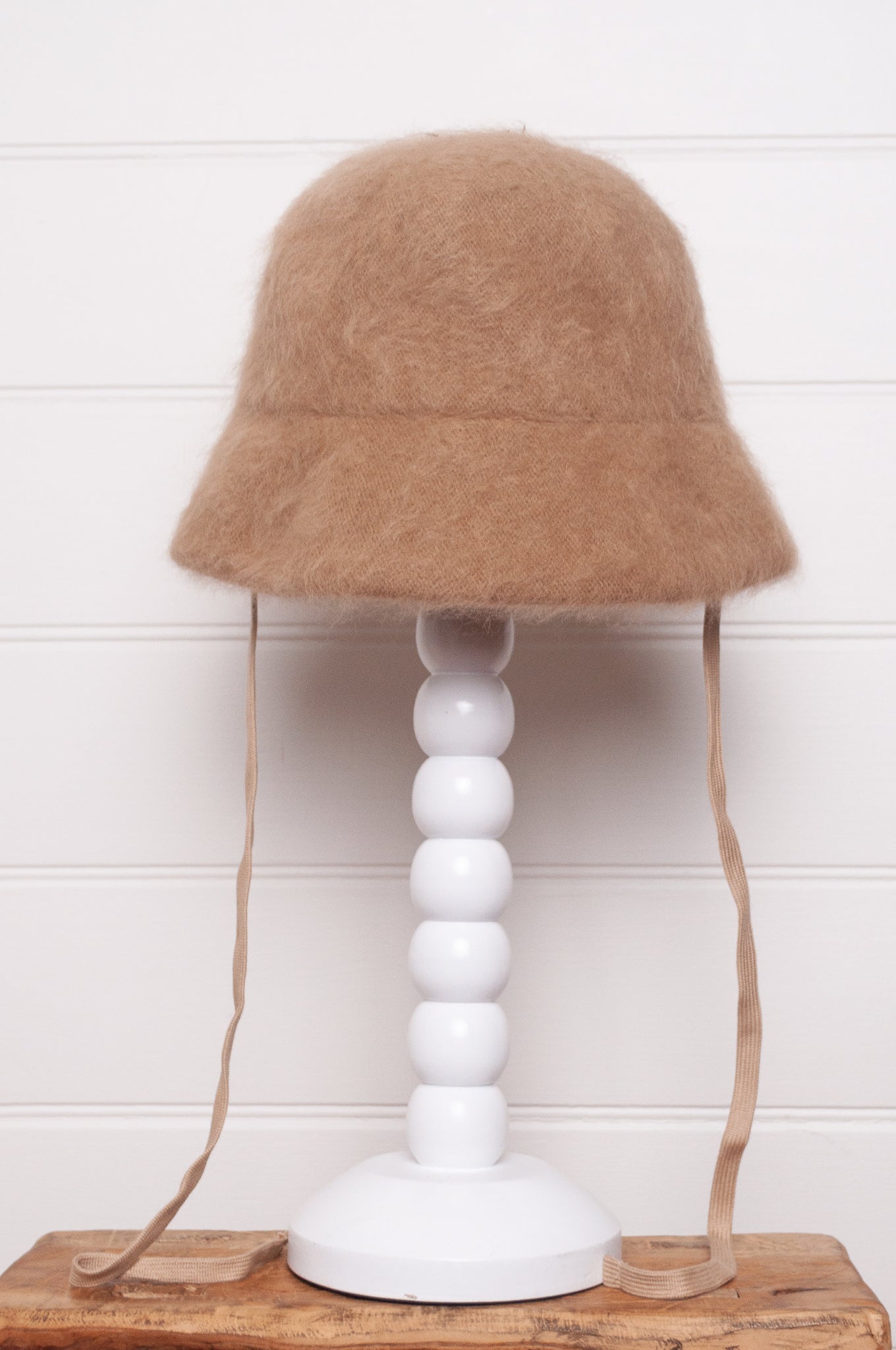 Parcnique PCNQ Bell cloche hat in angora wool blend with ribbon ties in camel beige.