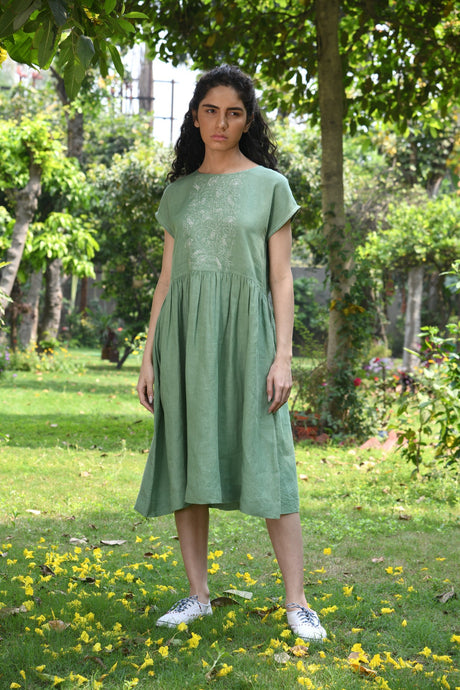 DVE Vachi embroidered linen dress in basil green.