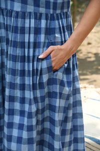 DVE classic Toshni dress in natural indigo check handloom cotton, short sleeves, gathered skirt.
