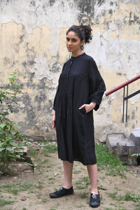 DVE Erina dress in black linen, button up tunic style, dropped shoulder with gathered sleeves.