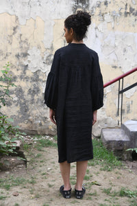 DVE Erina dress in black linen, button up tunic style, dropped shoulder with gathered sleeves.