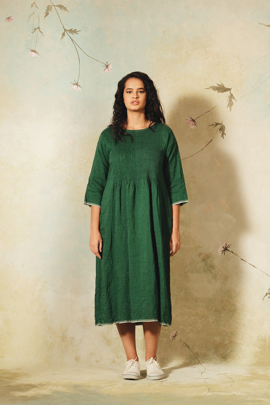 Dve emerald green linen Raka dress pintucked bodice, selvedge details.