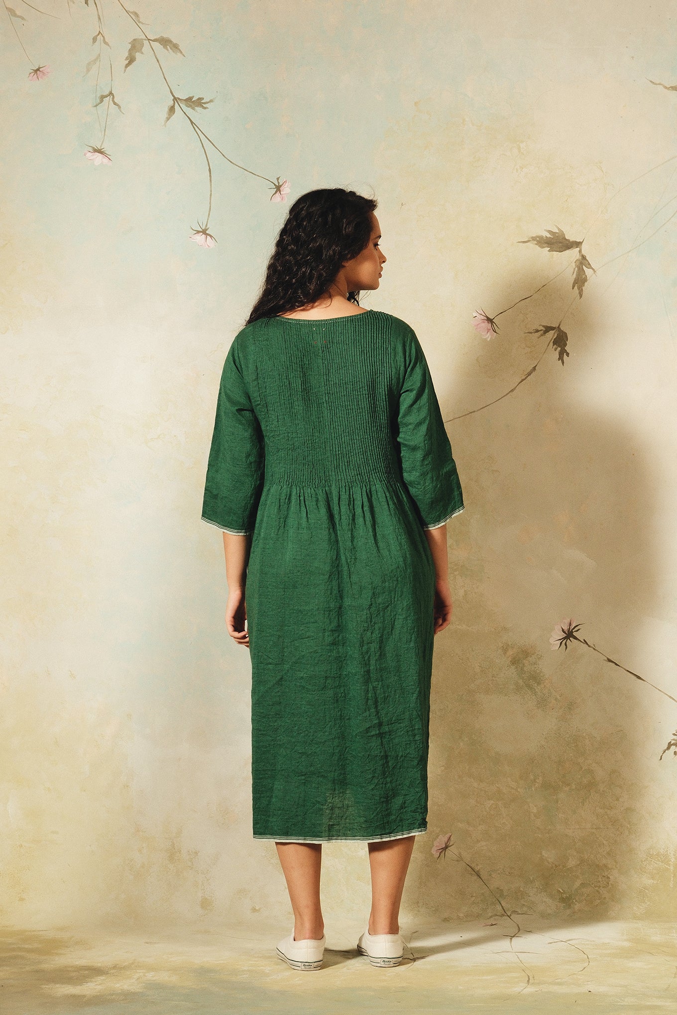 Dve emerald green linen Raka dress pintucked bodice, selvedge details.