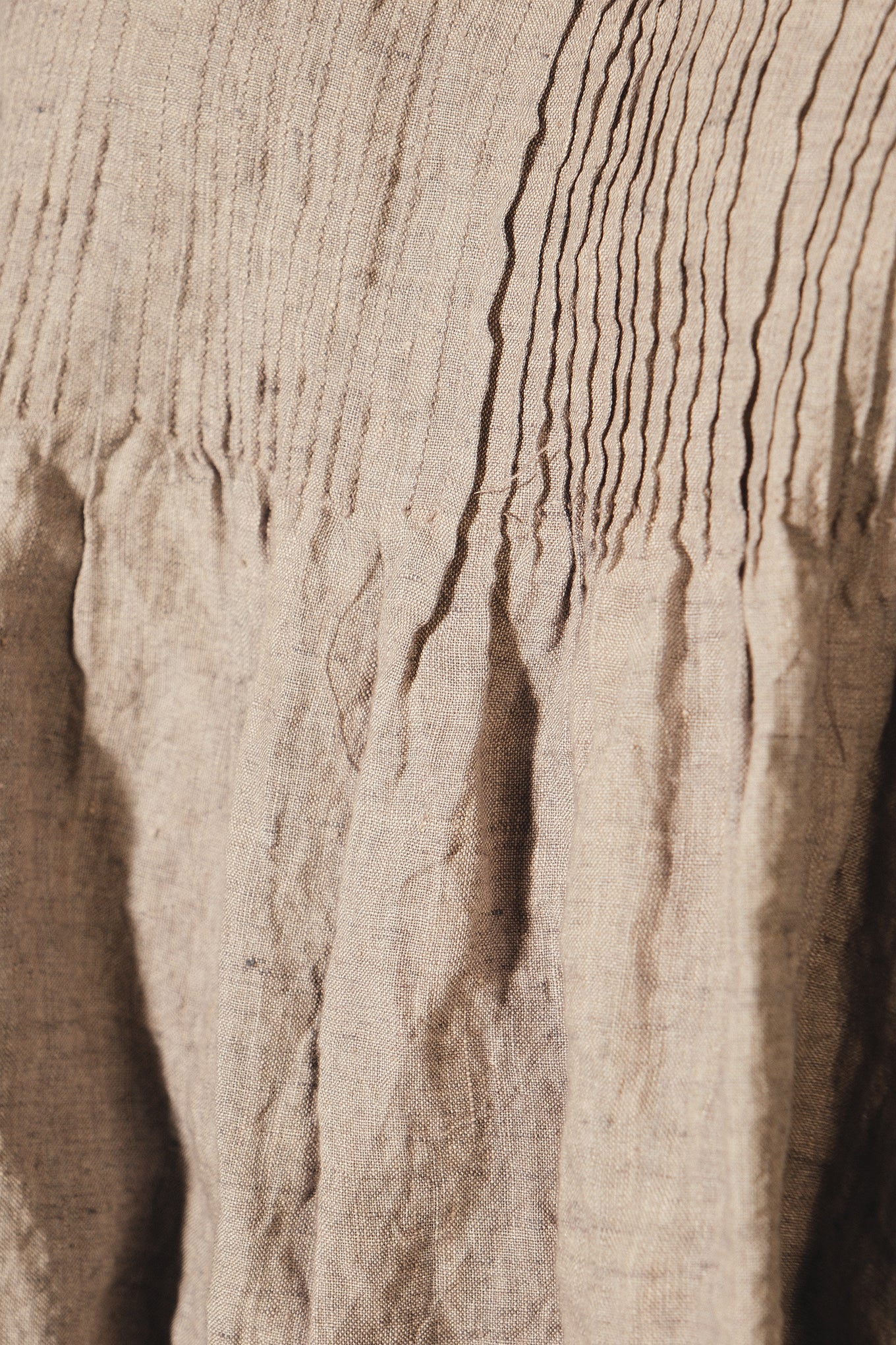 DVE Adya pintucked sleeveless linen top in ash beige linen.