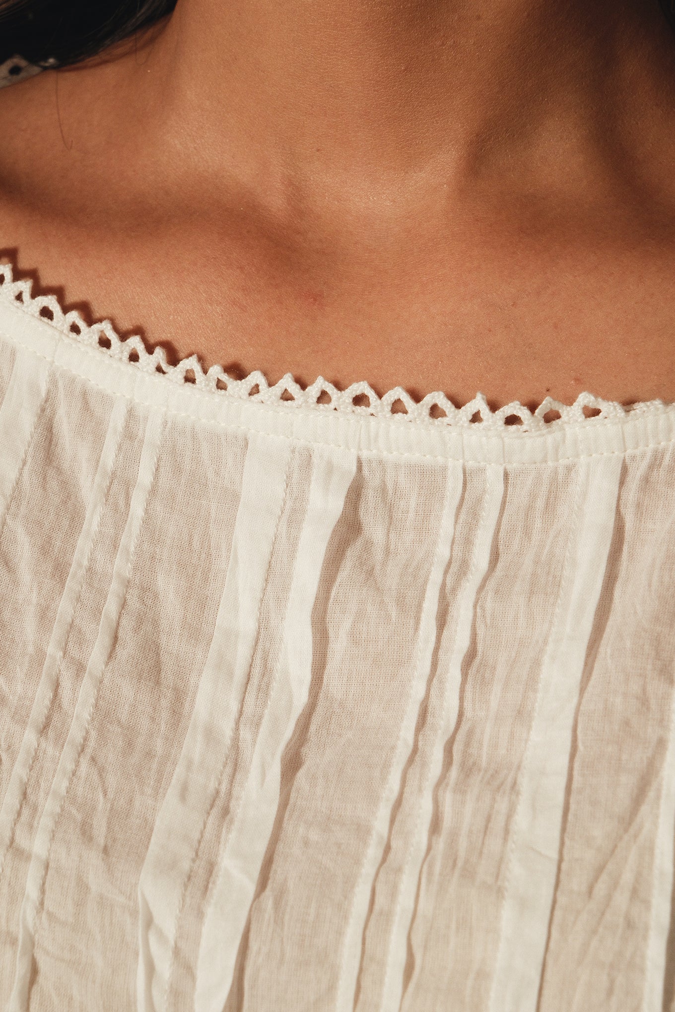 DVE Aishani white cotton voile top with lace insets.