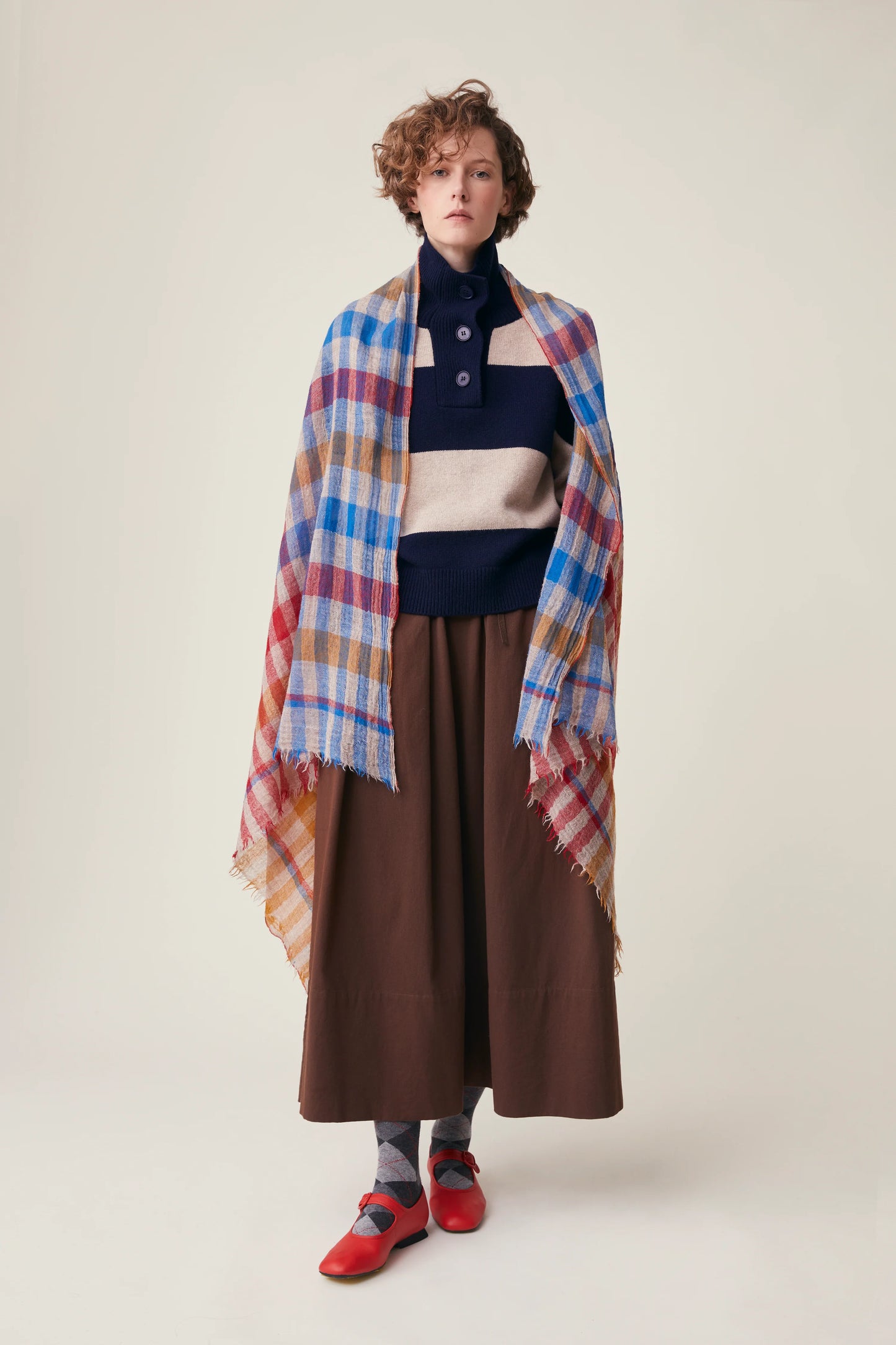 Moismont fine wool plaid tartan check scarf Acrobat in Celtic red, orange, mustard yellow, blue, tan and white.