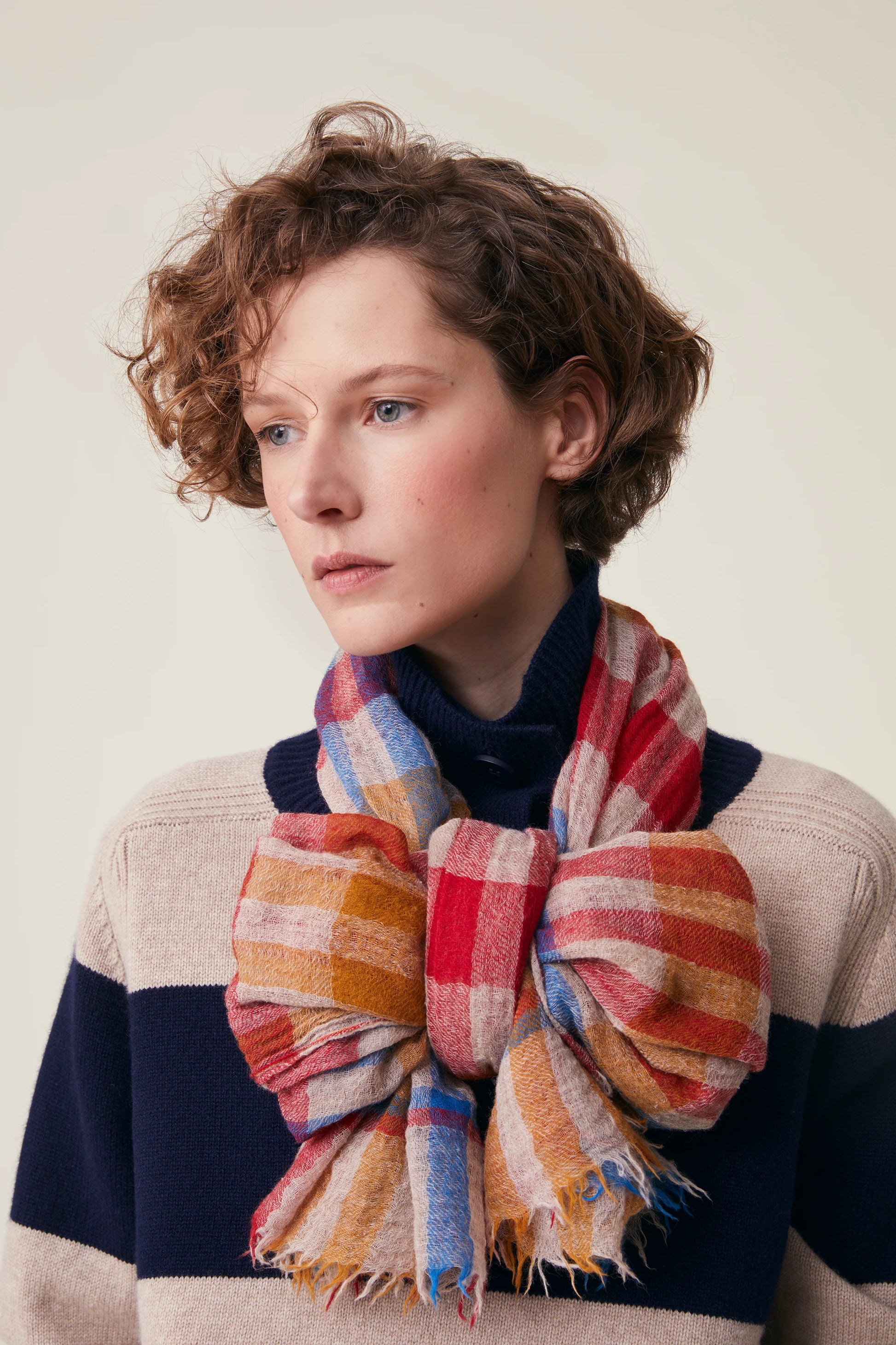 Moismont fine wool plaid tartan check scarf Acrobat in Celtic red, orange, mustard yellow, blue, tan and white.