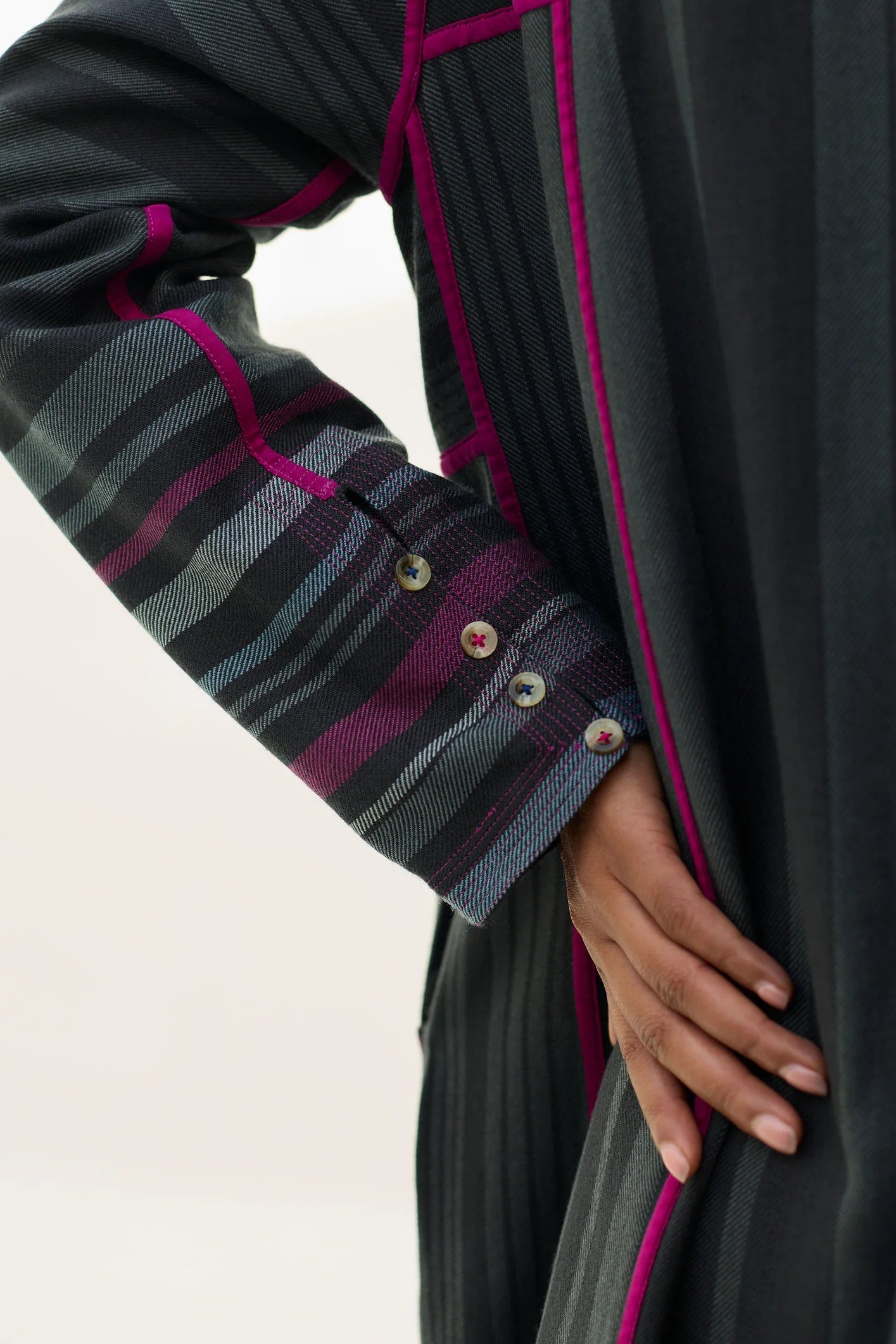 Manan Thena pure wool overlay jacket in charcoal grey stripe. Sleeve detail.