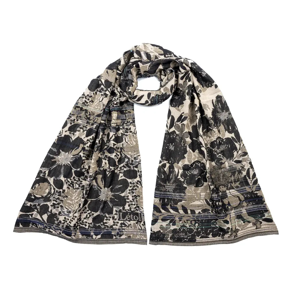 Letol organic cotton floral jacquard scarf Emilienne floral design in black, with highlights of blue.