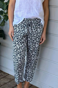 Frockk Jessie linen pants in navy and white floral print.