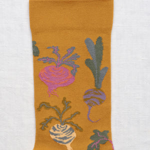 Bonne Maison ochre socks with beetroots and other vegetables.