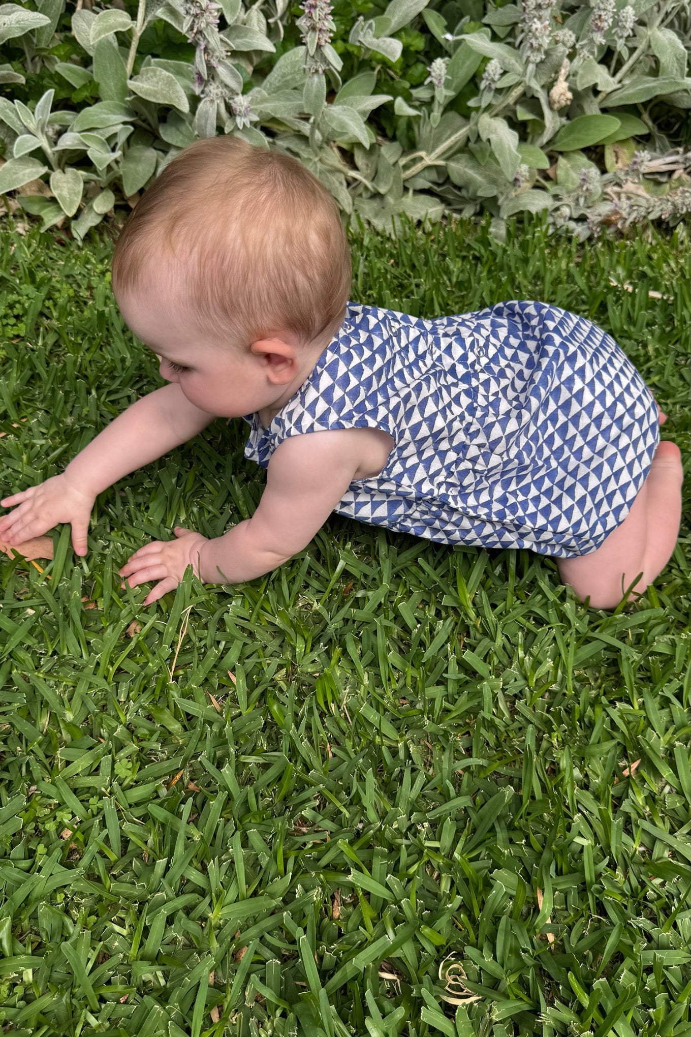 Juni Kids pure cotton blockprint baby romper in cobalt blue triangles on white.